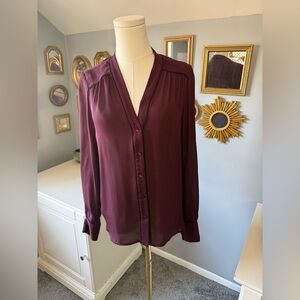 Vince semi sheer silk burgundy blouse with black piping.